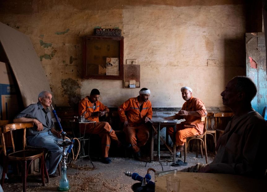 Many of the submissions to the "Post-Card Africa" initiative show scenes from everyday life. This image by Amina Kadous shows a group of street cleaners at a coffee shop in Old Cairo.