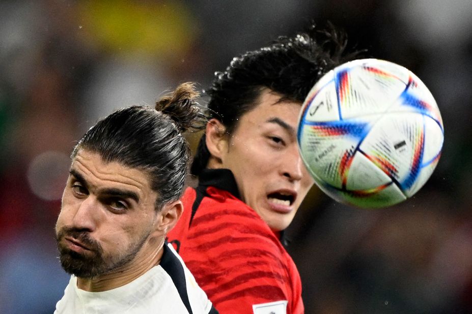 Portugal's Ruben Neves, left, heads the ball against South Korea.