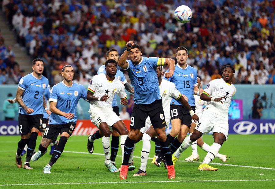 Uruguay's Luis Suarez, foreground, looks to head the ball against Ghana.