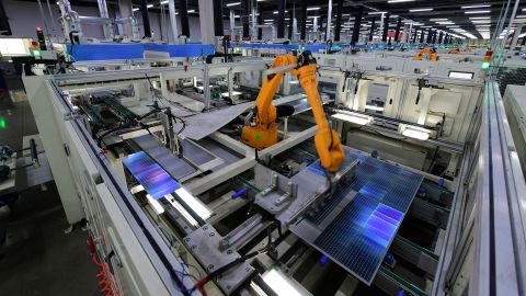 A robotic arm works on the production line of solar panels at a factory of Trina Solar Energy Co., in China in January.