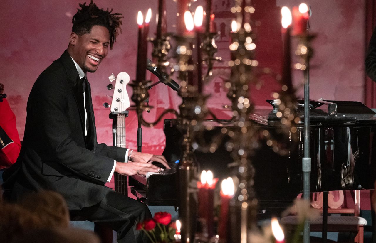 Musician Jon Batiste performs at the event.