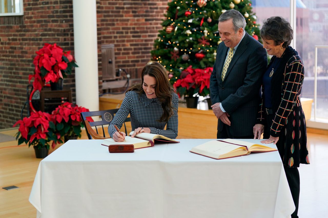 Catherine, Princess of Wales, signs a visitors book Friday while visiting the Center on the Developing Child at Harvard University.