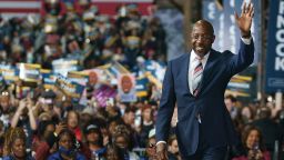 Senator Raphael Warnock, a Democrat from Georgia, walks on stage during a campaign rally in Atlanta, Georgia, US, on Thursday, Dec. 1, 2022. Former President Barack Obama returned to Georgia to campaign for Warnock in the closing days of the runoff election with Republican Herschel Walker. 
