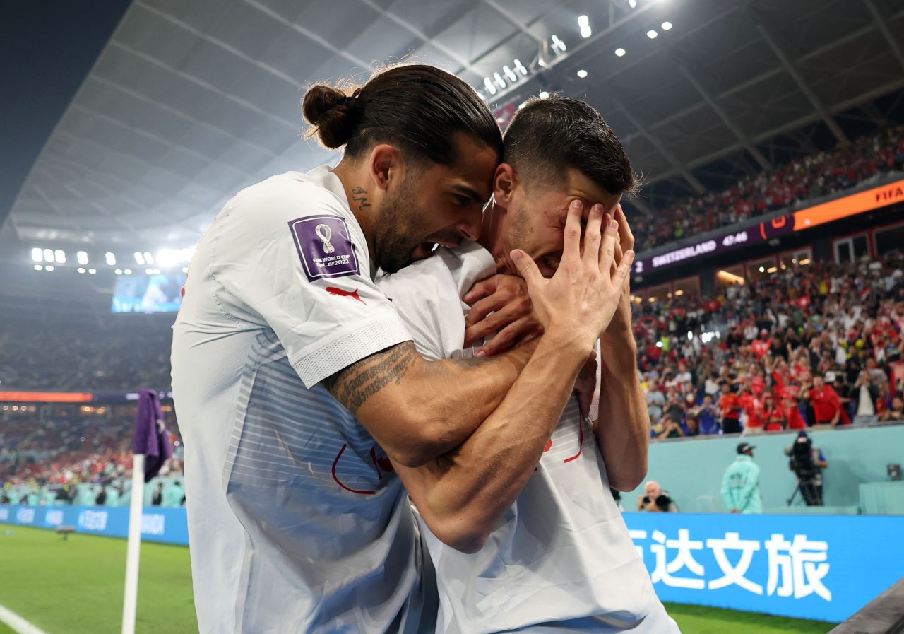 Switzerland's Remo Freuler, right, celebrates with Ricardo Rodriguez after scoring the third and decisive goal in the 3-2 victory over Serbia on December 2. With the win, Switzerland advanced to the next stage of the World Cup.