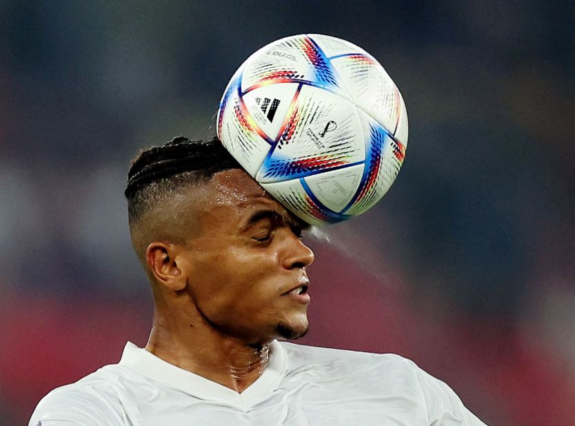 Switzerland's Manuel Akanji heads the ball during the Serbia match.