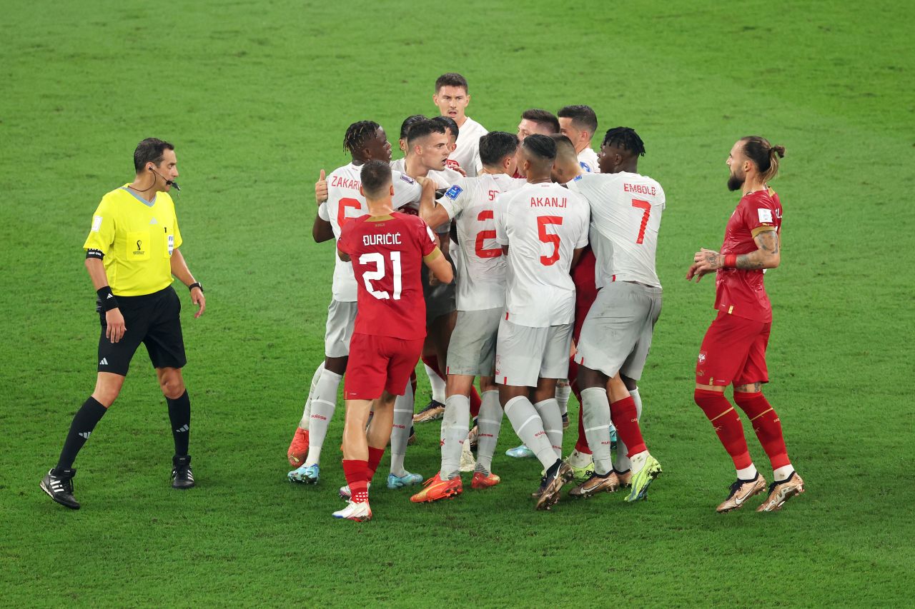Players argue during the Serbia-Switzerland match. Serbia was eliminated with the loss.