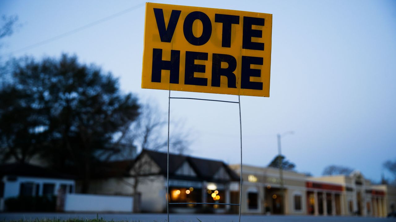 A sign is posted before polls open in Columbia, South Carolina, for the state's primary on February 29, 2020.