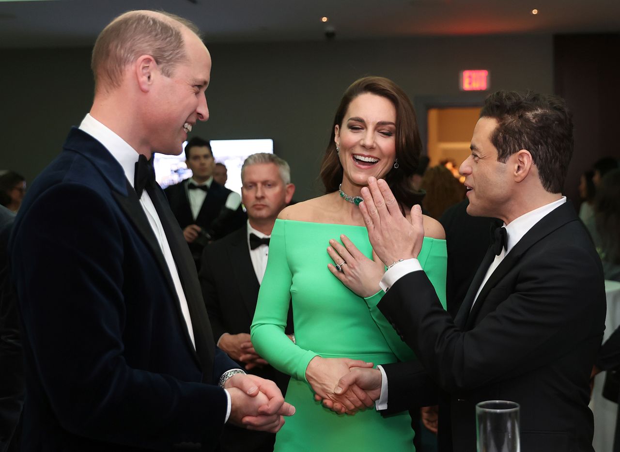 Britain's Prince William and Catherine, Princess of Wales, chat with actor Rami Malek on Friday. 