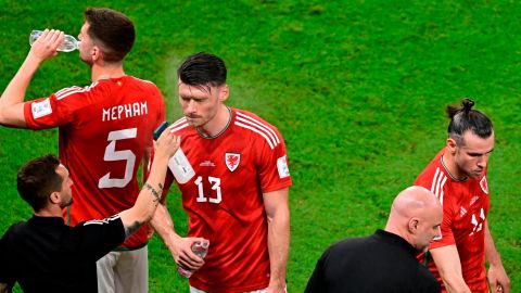 Wales forward Kieffer Moore is sprayed with water his team's game against England.