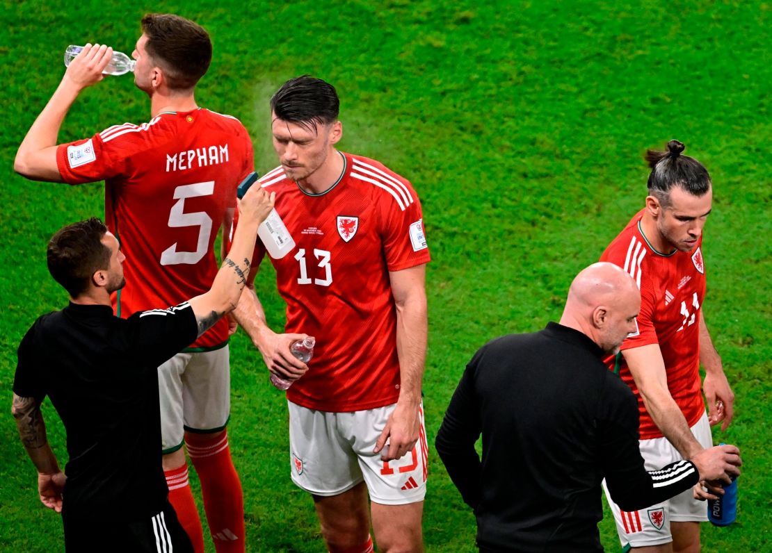 Wales forward Kieffer Moore is sprayed with water his team's game against England.