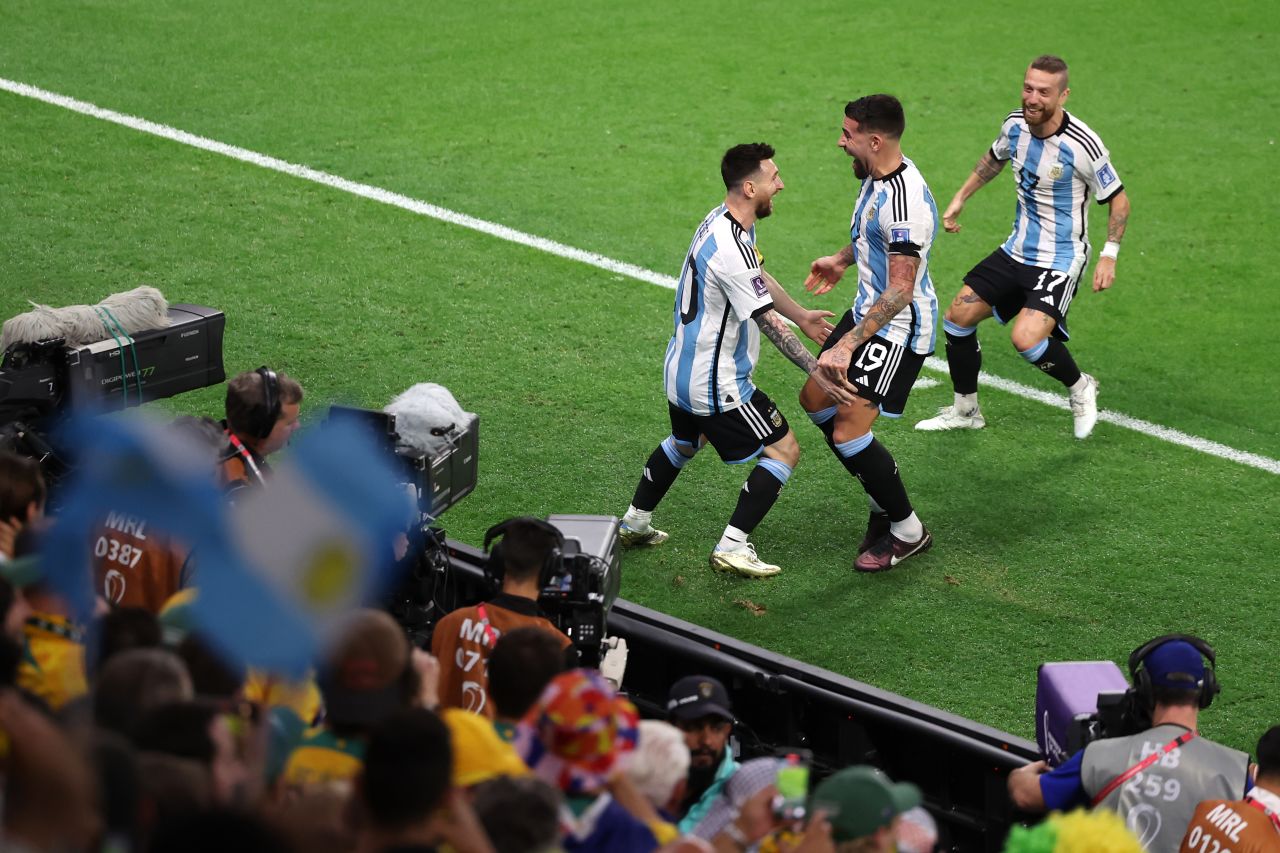 Argentina's Lionel Messi, left, celebrates with teammates after opening the scoring against Australia on December 3. Argentina's 2-1 victory set up a quarterfinal match against the Netherlands.
