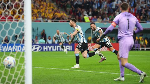 Messi celebrates after he scores against Australia. 