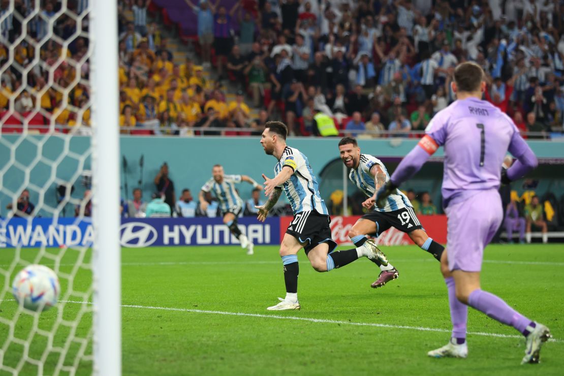 Messi celebrates after he scores against Australia. 