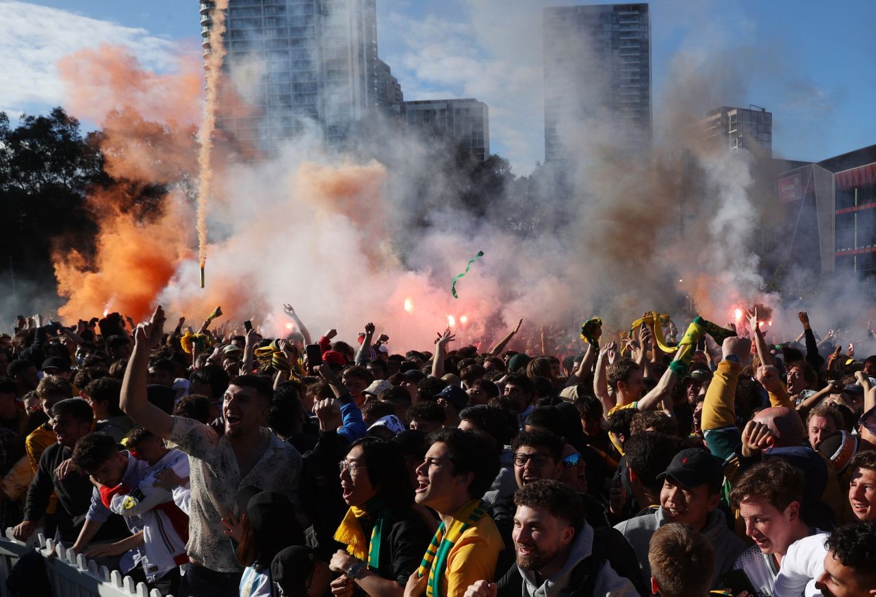 Australian fans in Sydney celebrate their team's goal against Argentina on December 3.