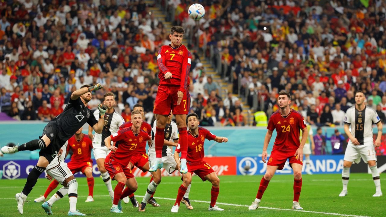 Spain's Álvaro Morata jumps to head the ball.
