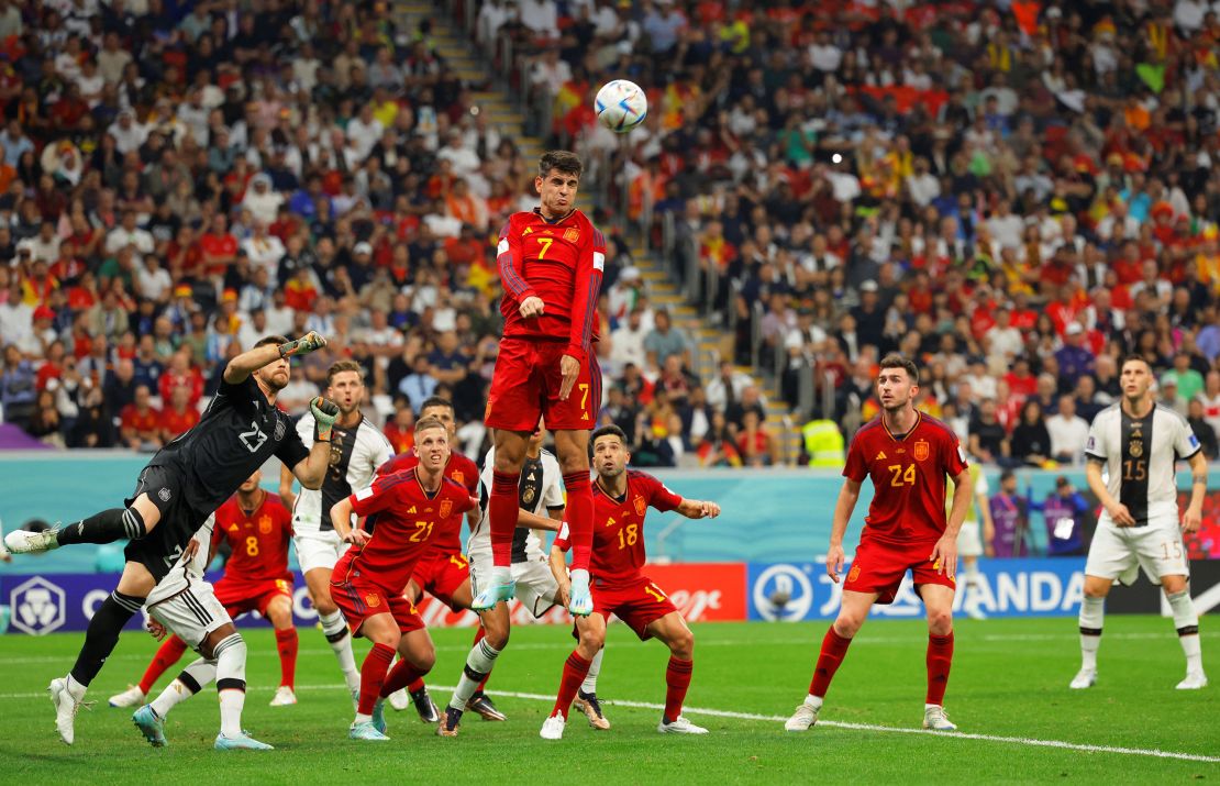 Spain's Álvaro Morata jumps to head the ball.