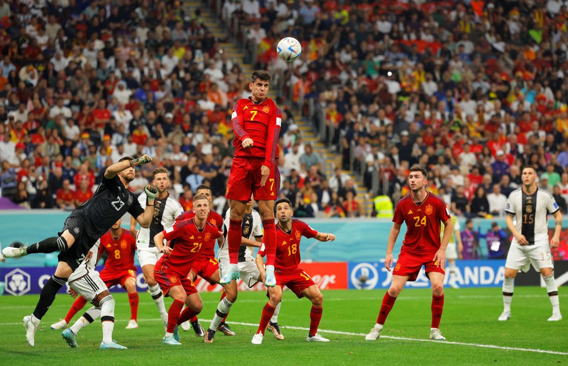 Spain's álvaro Morata jumps to head the ball.