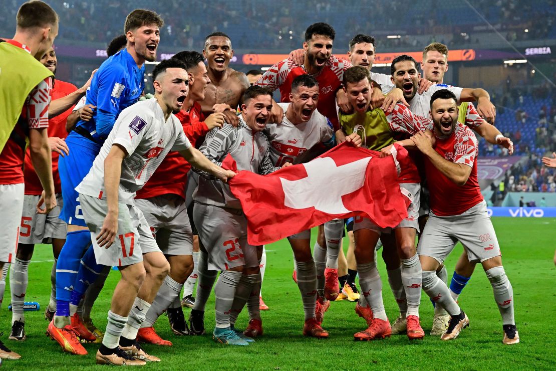 Switzerland celebrates defeating Serbia 3-2 and qualifying for the knockout stages.