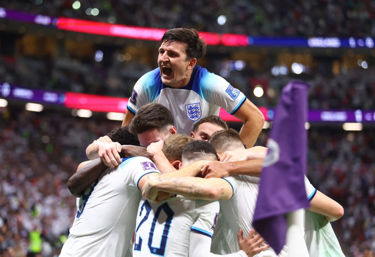 England players celebrate after Harry Kane scored against Senegal on Sunday, November 4. England won 3-0 to advance to the quarterfinals.