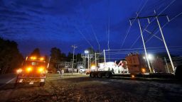 Duke Energy personnel work to restore power at a crippled electrical substation and caused a mass power outage, in Carthage, North Carolina. US officials have been worried about such attacks by domestic extremists for years. 