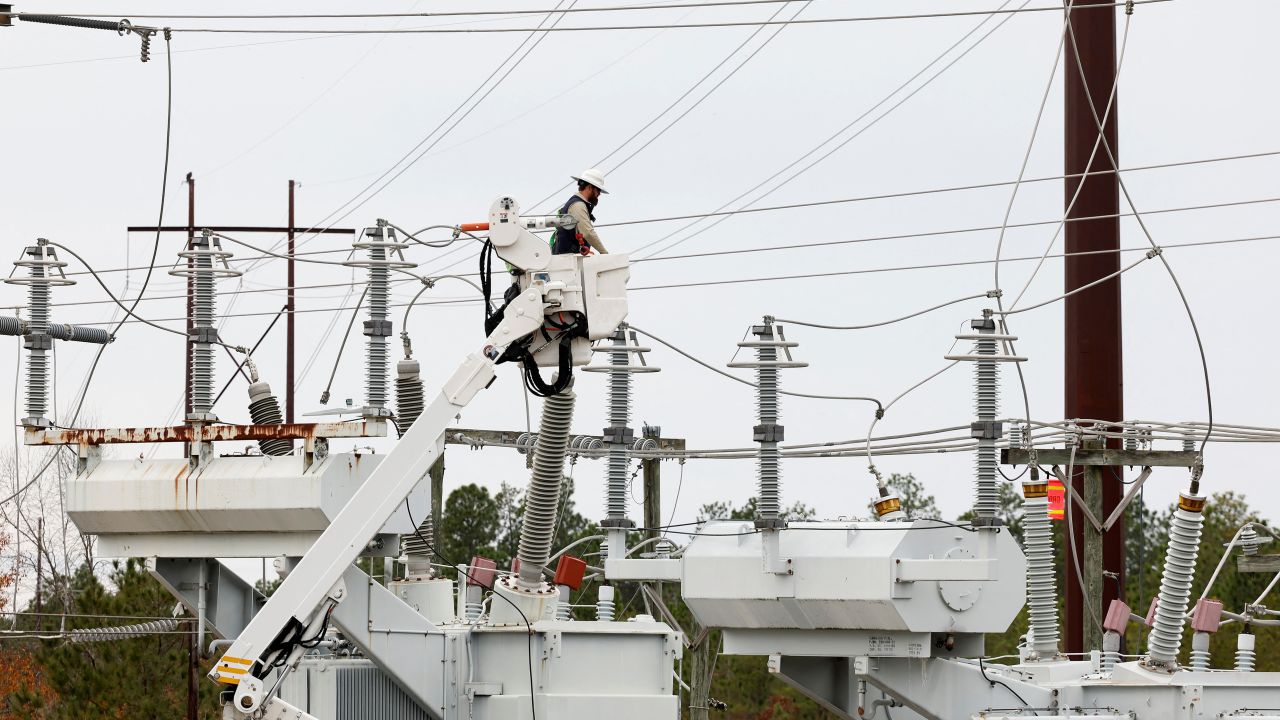 Duke Energy personnel work to restore power at a crippled electrical substation in Carthage, North Carolina.