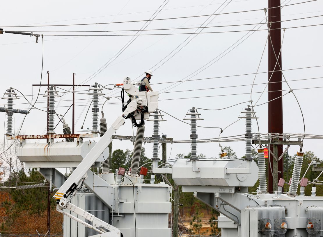 Duke Energy personnel work to restore power at a crippled electrical substation in Carthage, North Carolina.
