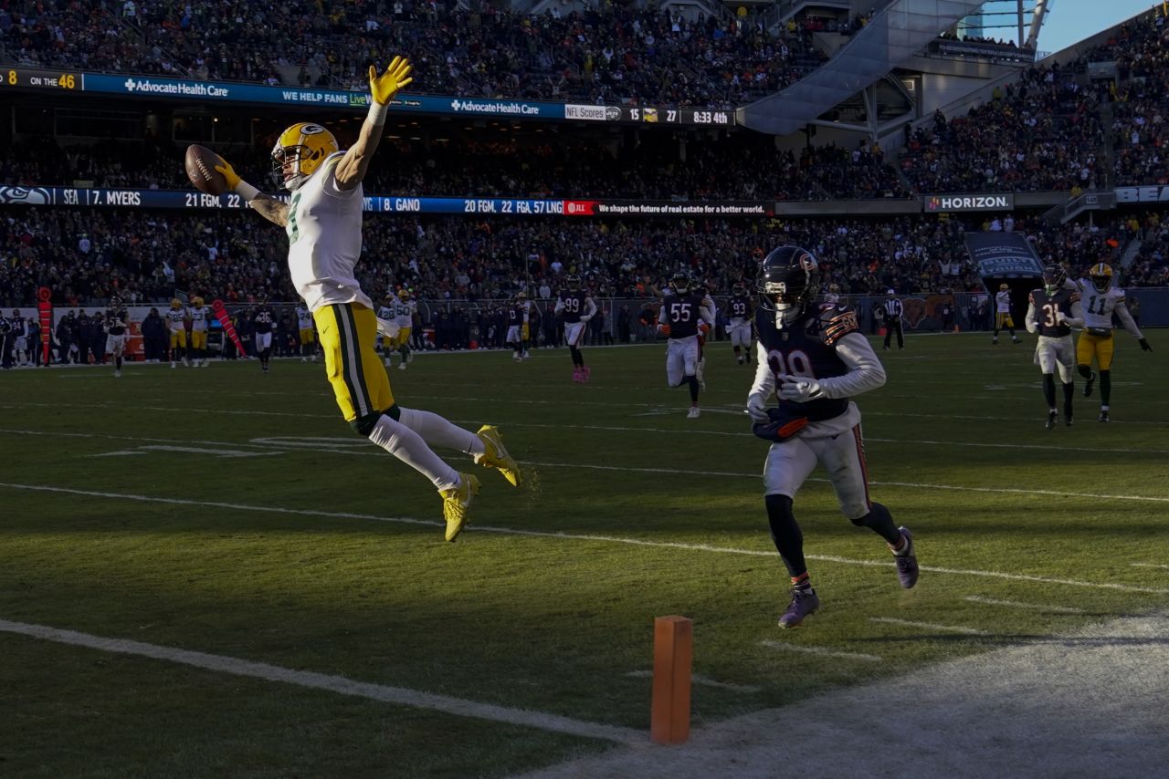 Green Bay Packers' Christian Watson celebrates as he crosses the goal line after catching a touchdown pass from Aaron Rodgers during the second half of a game against the Chicago Bears. Watson had two touchdowns in the Packers' 28-19 victory over the Bears.