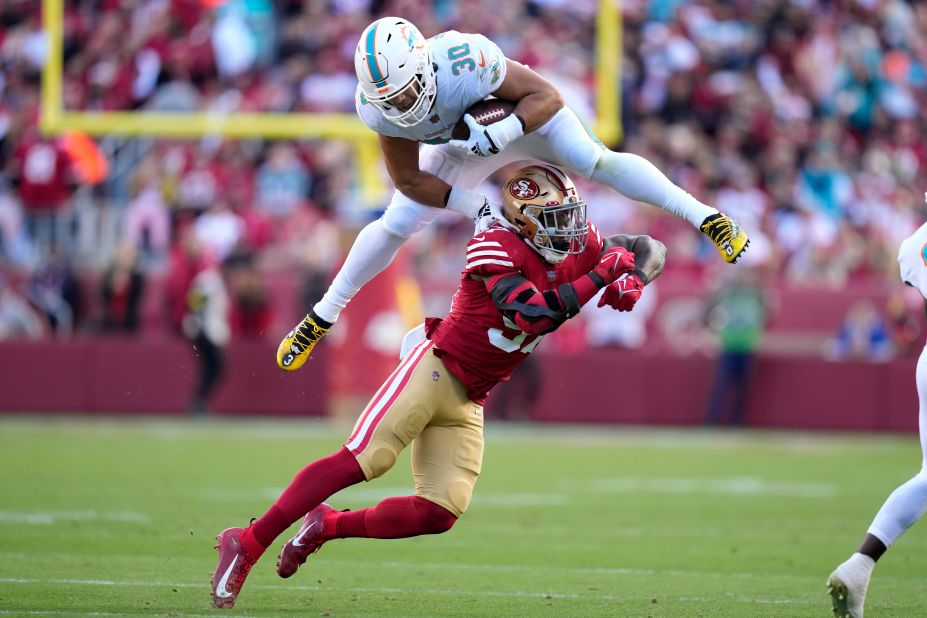 Miami Dolphins fullback Alec Ingold hurdles over San Francisco 49ers linebacker Dre Greenlaw during the first half of the teams' game. The 49ers, despite losing starting quarterback Jimmy Garoppolo to a season-ending injury early on, beat the Dolphins 33-17. 