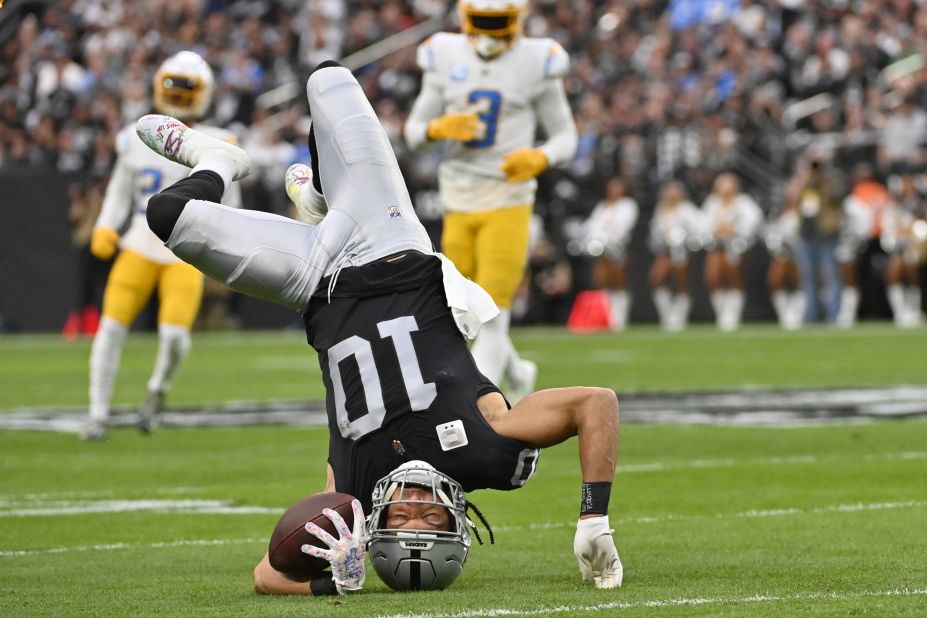 Las Vegas Raiders wide receiver Mack Hollins goes upside down on a reception during the first half against the Los Angeles Chargers. The Raiders eventually beat the Chargers 27-20, largely thanks to a monster afternoon for star wide receiver Davante Adams, who finished with 177 receiving yards and two touchdowns. 