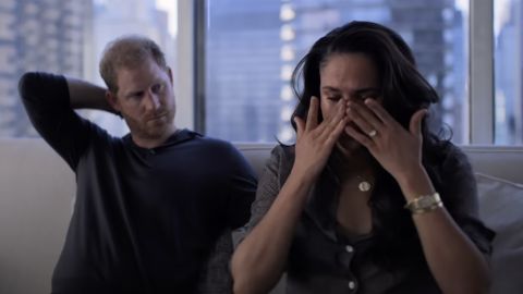 A frame from the documentary shows Meghan crying.