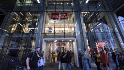 People walk past the Uniqlo retail store located along Fifth Avenue in New York, NY, October 27, 2022. The chain has added a self-checkout option at some stores.