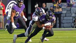 Dec 4, 2022; Baltimore, Maryland, USA; Baltimore Ravens quarterback Lamar Jackson (8) would leave the game after being sacked in the second quarter by Denver Broncos linebacker Jonathon Cooper (53) at M&T Bank Stadium. Mandatory Credit: Mitch Stringer-USA TODAY Sports