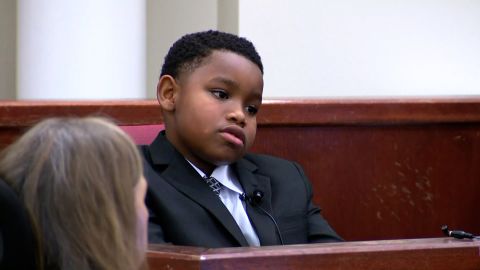 Zion Carr, 11, testified in court Monday that his aunt Atatania Jefferson heard a noise outside and so took a gun out of her purse moments before she was killed.