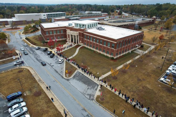 A line of early voters stretches outside the City Services Center in Columbus, Georgia, on November 26. About 300,000 Georgians voted early each day that week, <a  target="_blank">setting records for early voting turnout in the state</a>.