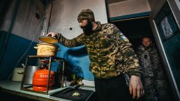 ZAPORIZHZHIA REGION, UKRAINE - NOVEMBER 24, 2022 - Oleksandr (call sign "Malyi"), chef of a well-known restaurant in Dnipro, cooks delicious meals for the military defending Ukraine from the Russian occupiers in the Zaporizhzia direction, Zaporizhzhia Region, southeastern Ukraine. (Photo credit should read Dmytro Smoliyenko / Ukrinform/Future Publishing via Getty Images)
