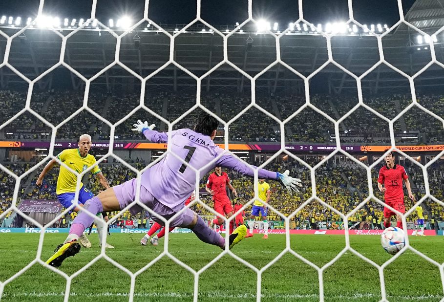 Richarlison, left, scores Brazil's third goal during the World Cup match against South Korea on December 5. Brazil won 4-1 to advance to the quarterfinals.