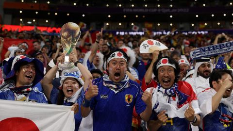 Japan supporters celebrate the team's World Cup Group E win against Spain.