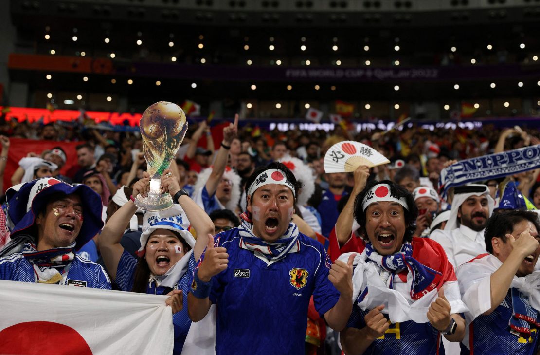 Japan supporters celebrate the team's World Cup Group E win against Spain.