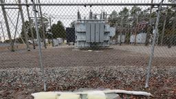 Barriers designed to absorb oil are placed neare a damaged transformer that Duke Energy workers said was hit by gunfire that crippled an electrical substation after the Moore County Sheriff said that vandalism caused a mass power outage, in Carthage, North Carolina, U.S. December 4, 2022.  REUTERS/Jonathan Drake