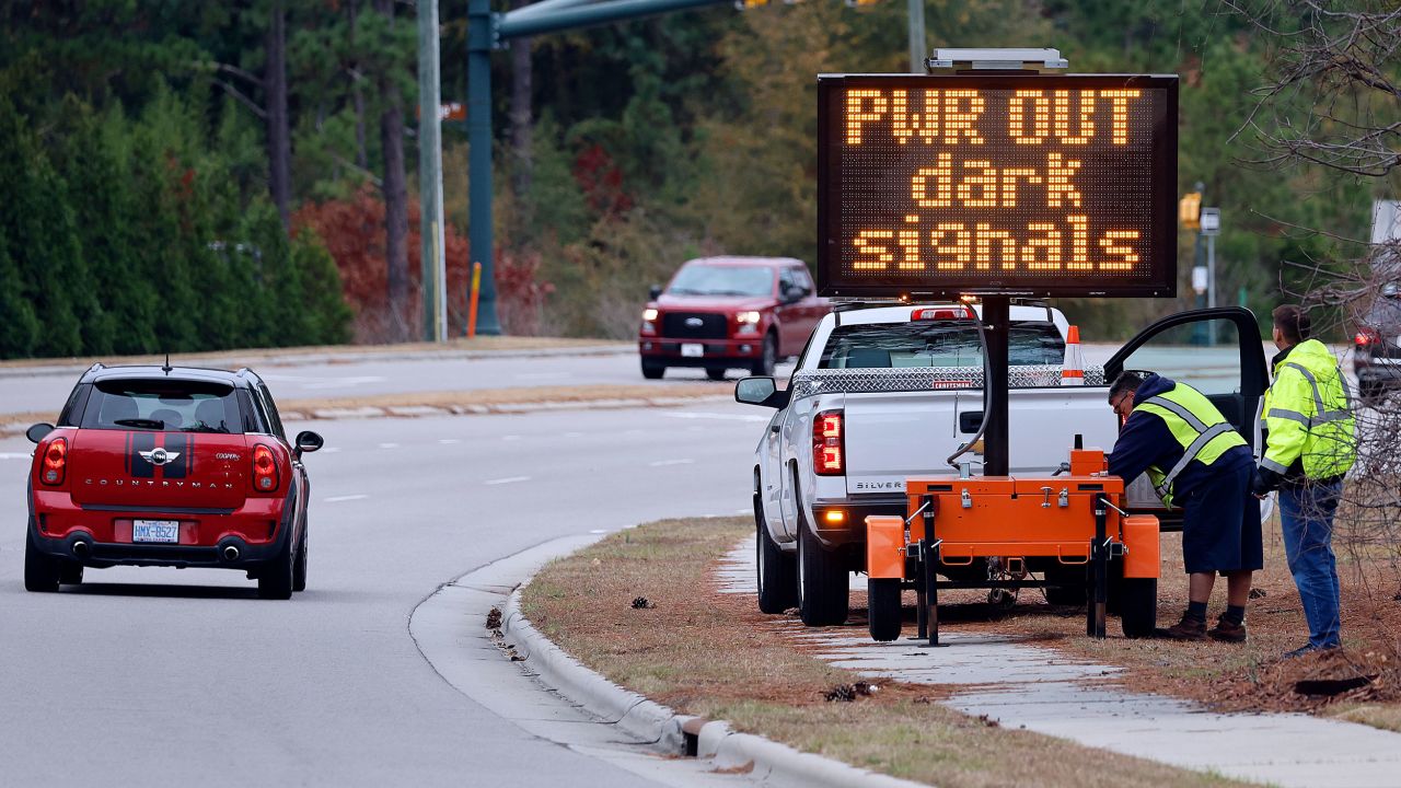 Officials warn drivers that power is out to traffic signals.