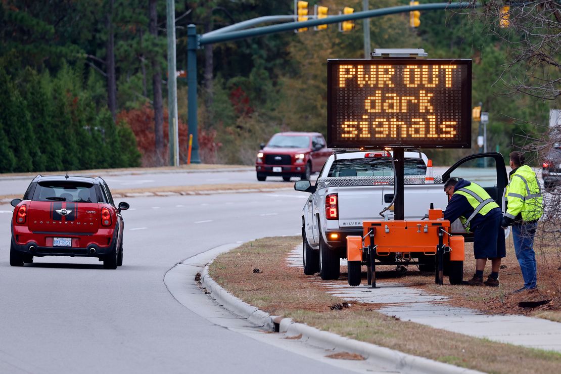 Officials warn drivers that power is out to traffic signals.
