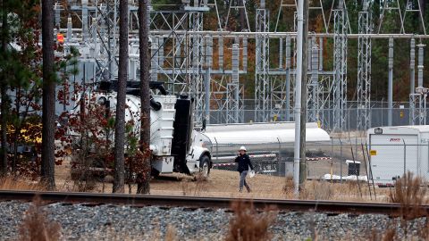 Crews work on equipment at a substation in West End, North Carolina, Monday.