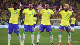 DOHA, QATAR - DECEMBER 05: Neymar of Brazil celebrates with Raphinha, Lucas Paqueta and Vinicius Junior after scoring the team's second goal via a penalty during the FIFA World Cup Qatar 2022 Round of 16 match between Brazil and South Korea at Stadium 974 on December 05, 2022 in Doha, Qatar. (Photo by Francois Nel/Getty Images)