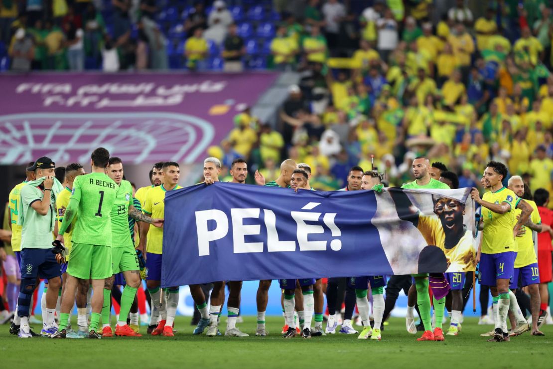 Brazil players hold a banner showing support for former Brazil player Pele after the FIFA World Cup Qatar 2022 Round of 16 match between Brazil and South Korea on December 5. 