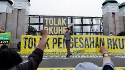 An activist shouts slogans during a protest as Indonesia is set to pass a new criminal code that will ban sex outside marriage, cohabitation between unmarried couples, insulting the president, and expressing views counter to the national ideology, outside the Indonesian Parliament buildings in Jakarta, Indonesia, December 5, 2022.