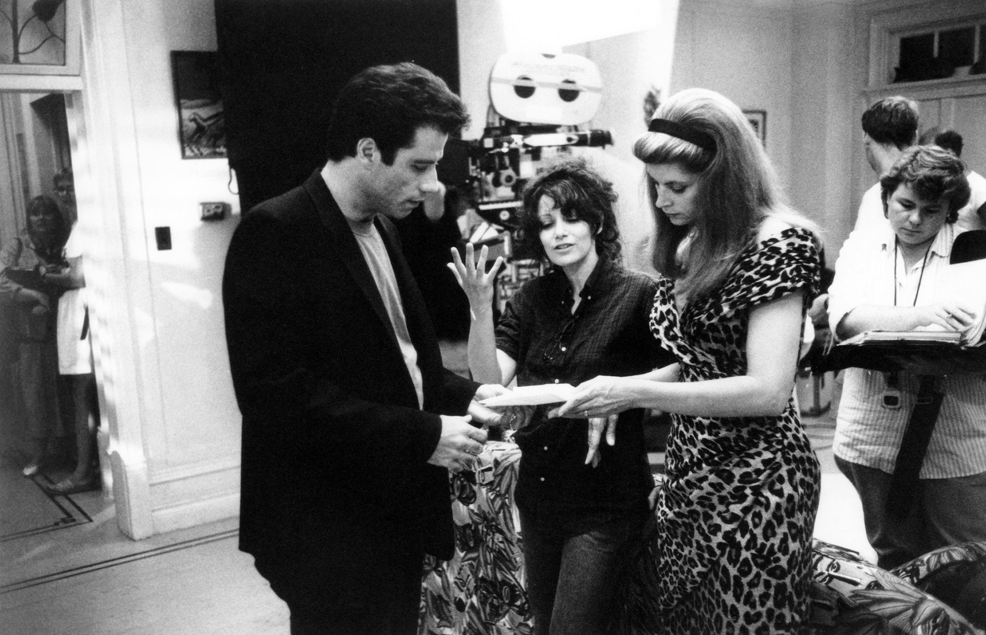 John Travolta, director Amy Heckerling, and Alley on set of the hit film 'Look Who's Talking,' which was released in 1989.