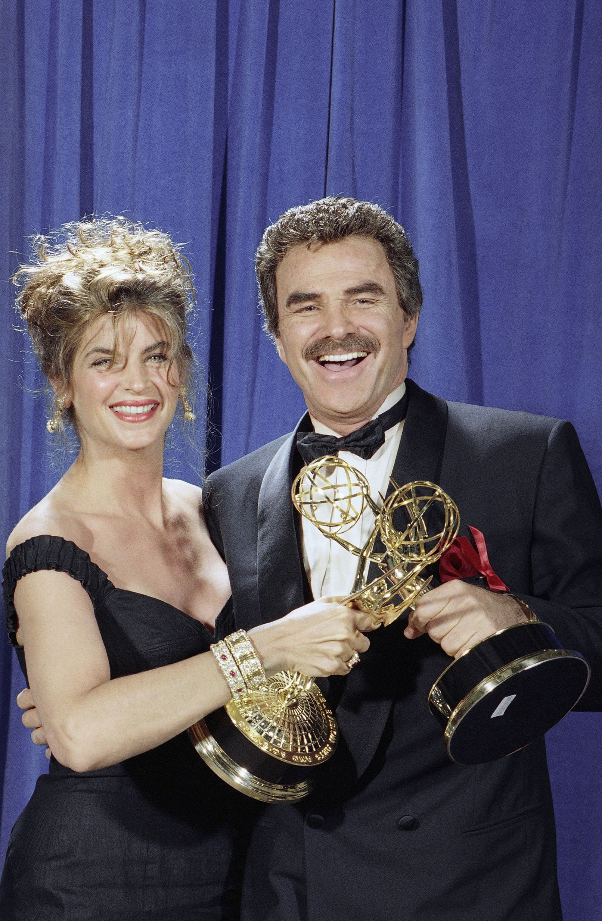 Alley and Burt Reynolds share a laugh backstage at the Emmy Awards in Pasadena, California in 1991. Both won awards for best acting in a comedy series, Alley for 'Cheers' and Reynolds for 'Evening Shade.'