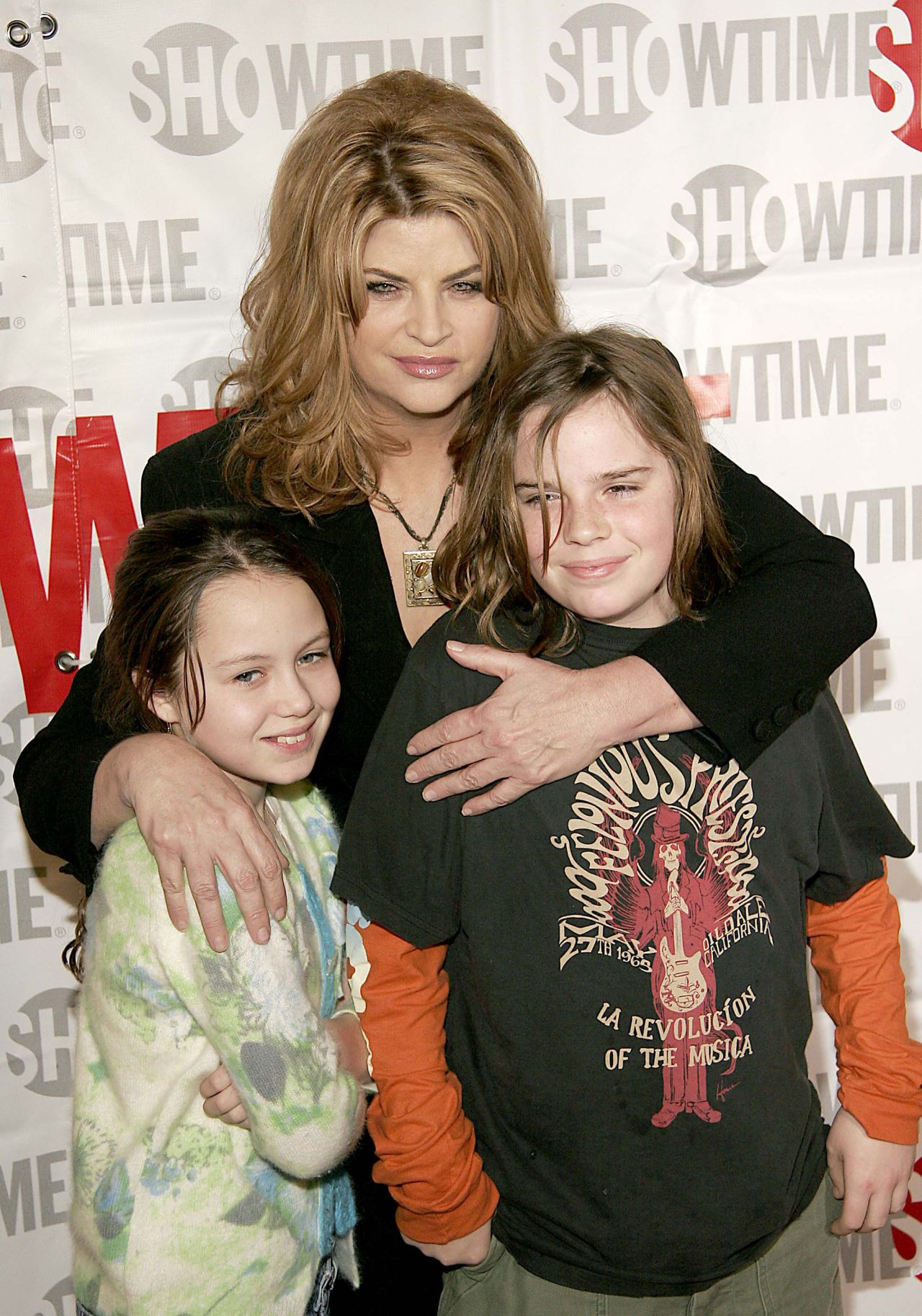 Alley poses with her children Lillie and True at a press event in California in 2005. 