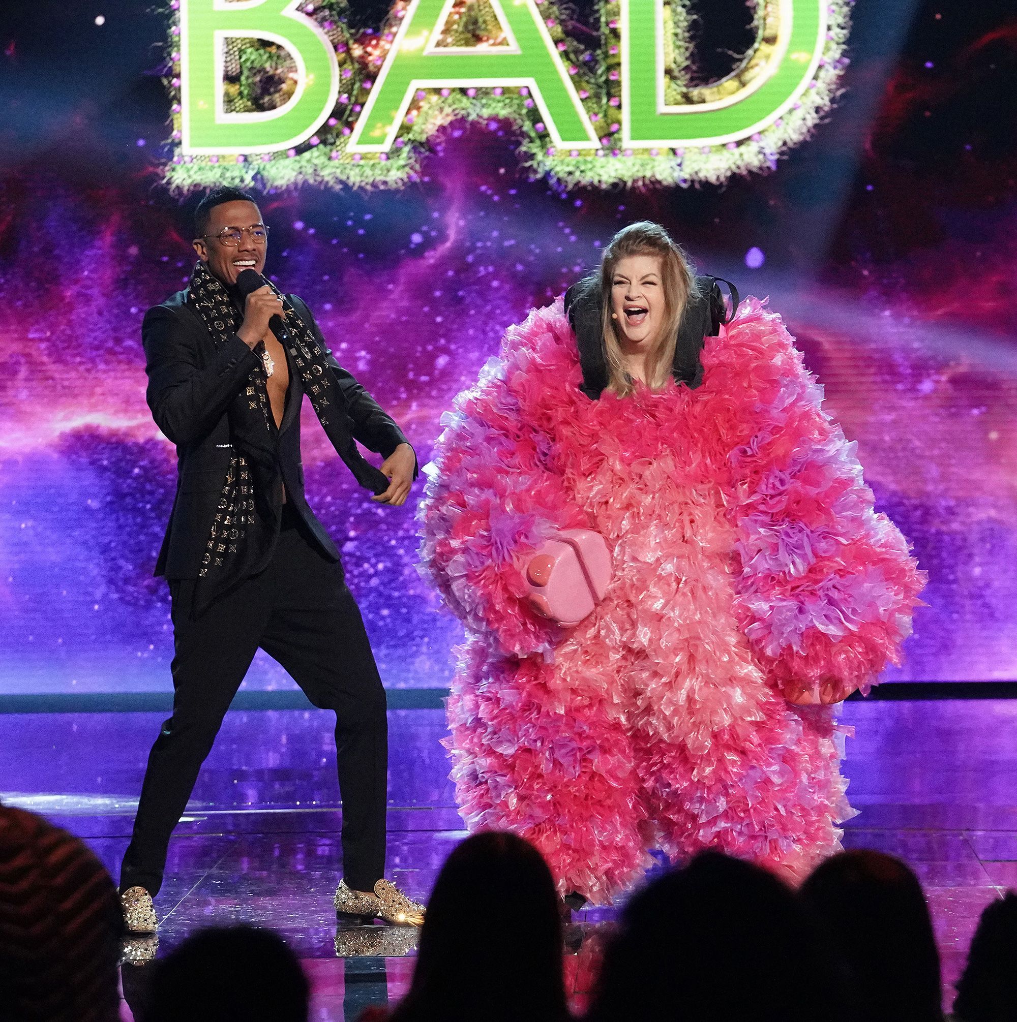 Nick Cannon and Alley react during Alley's unmasking on 'The Masked Singer' earlier this year.