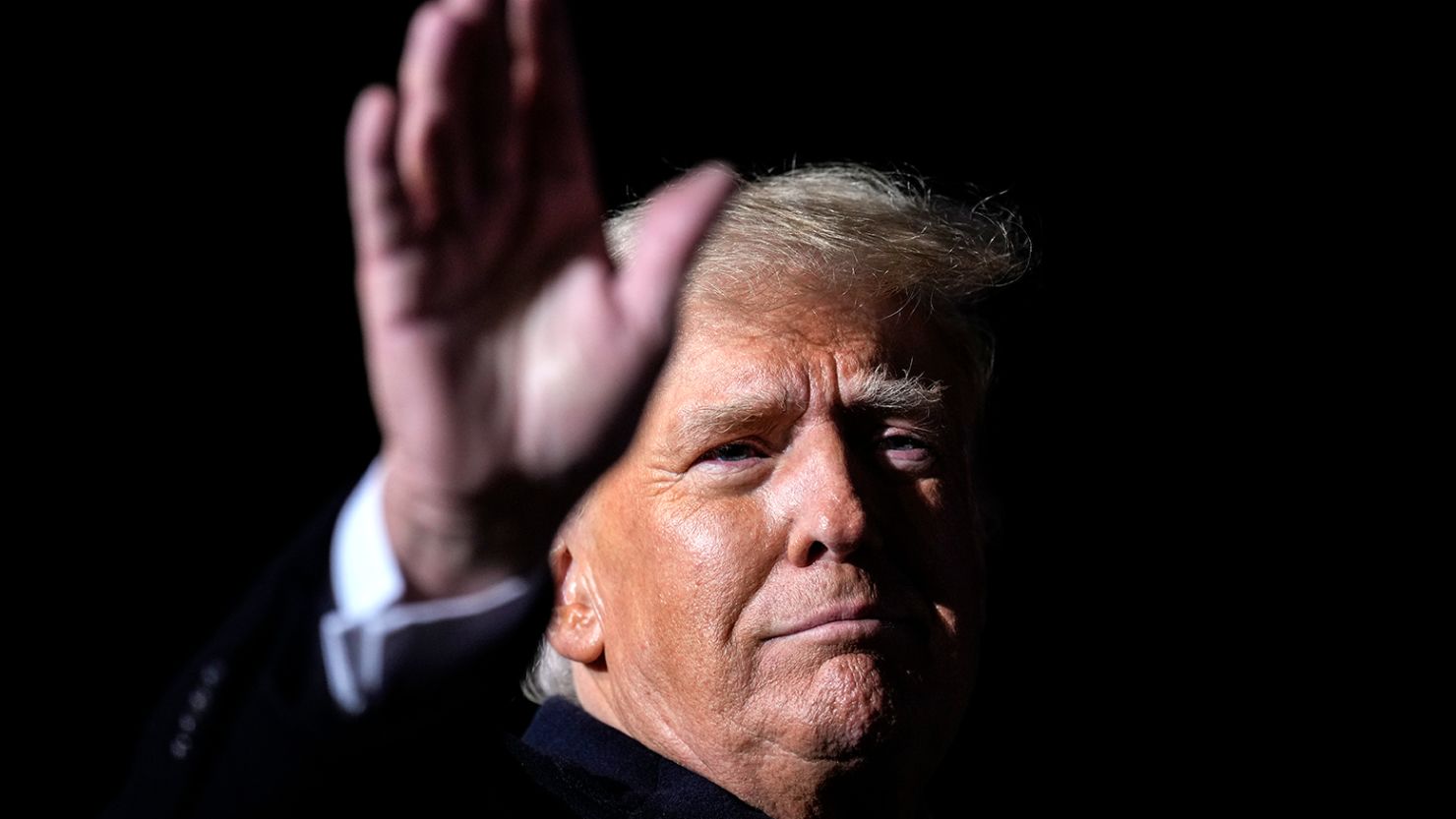 Former President Donald Trump waves at the end of a rally at the Dayton International Airport on November 7, 2022, in Vandalia, Ohio.?